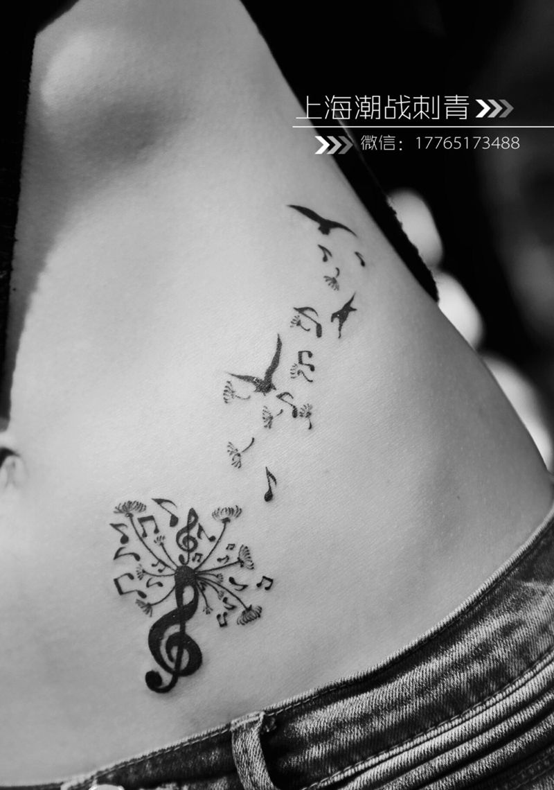 飞扬的音符纹身图片_成品腰部清新字符纹身图案