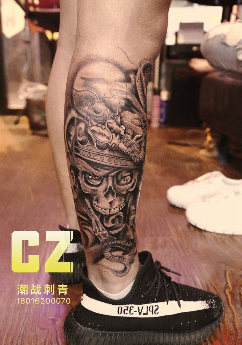龙盘骷髅纹身图片_腿部新传统欧美写实纹身图案
