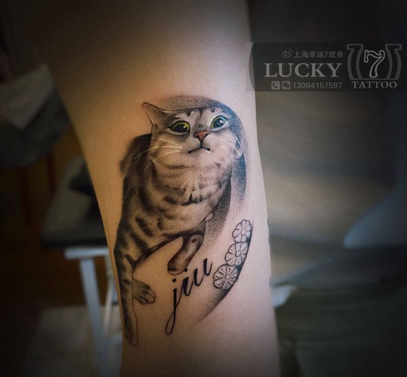 动感喵星人|幸运7纹身纹身图片_手臂欧美写实纹身图案