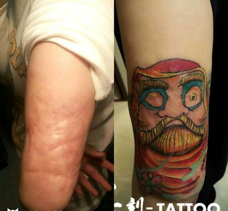 大疤痕遮盖，达摩不倒翁纹身图片_手臂欧美传统字符人物成品纹身图案