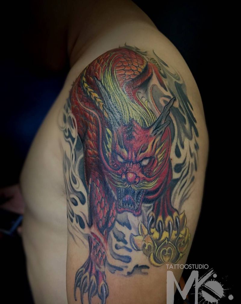 《浴火麒麟》纹身图片_手臂肩部老传统纹身图案