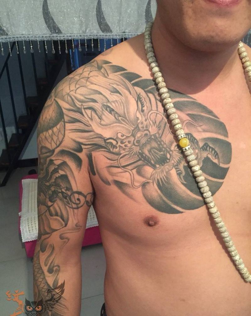 恢复的半甲龙纹身图片_成品手臂传统动物纹身图案