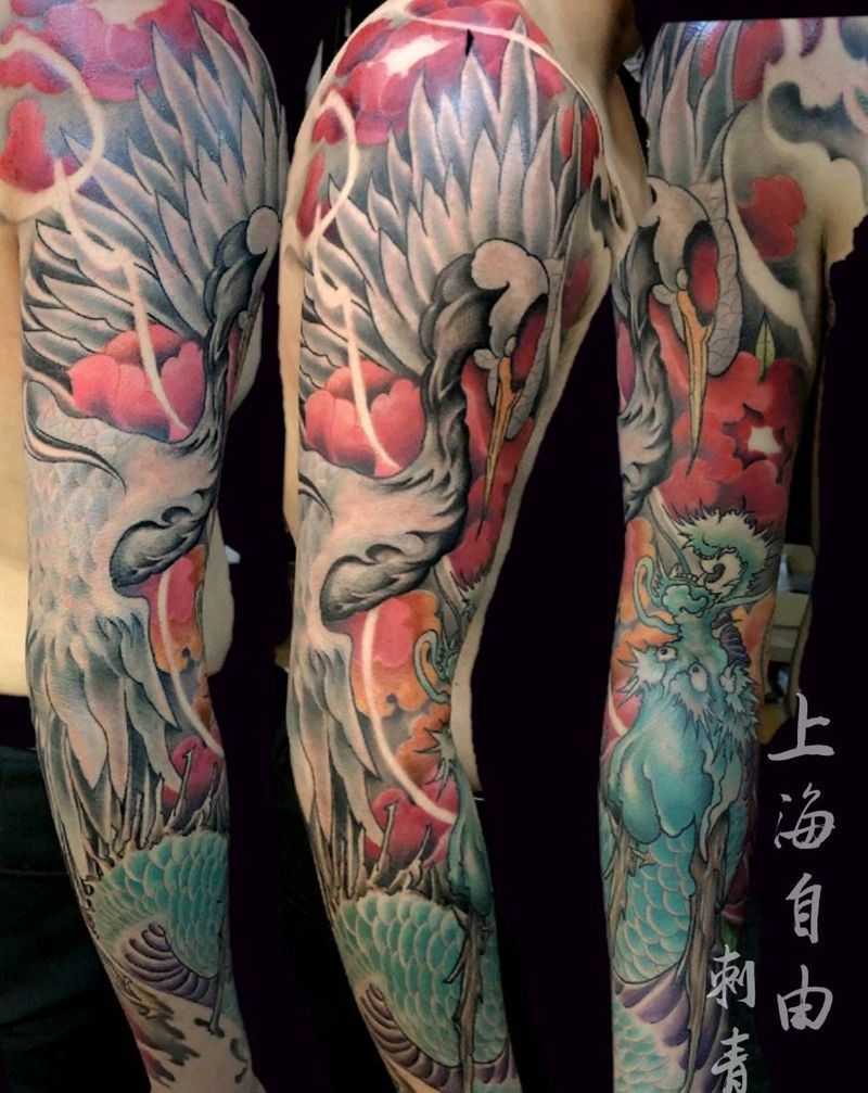 仙鹤盘龙戏牡丹纹身图片_手臂新传统仙鹤盘龙牡丹纹身图案