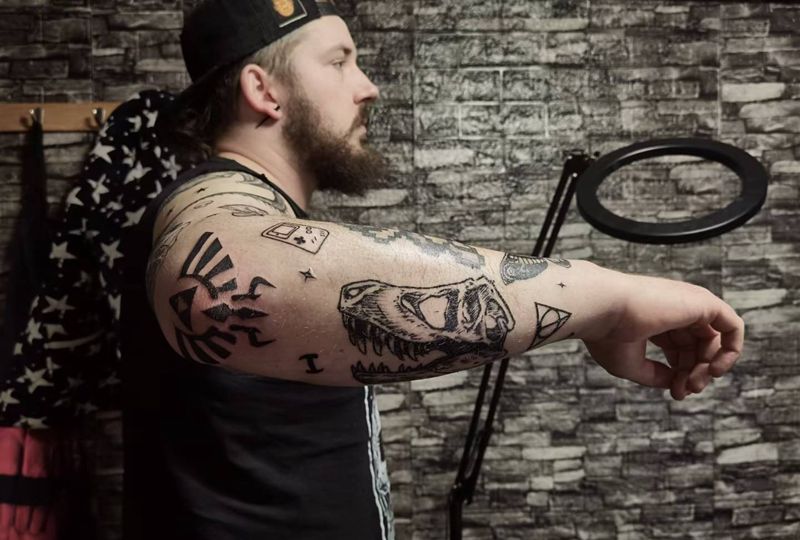 游戏元素拼接花臂纹身图片_手臂卡通纹身图案