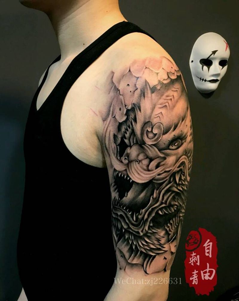 龙怒纹身图片_手臂欧美写实新传统石雕龙纹身图案