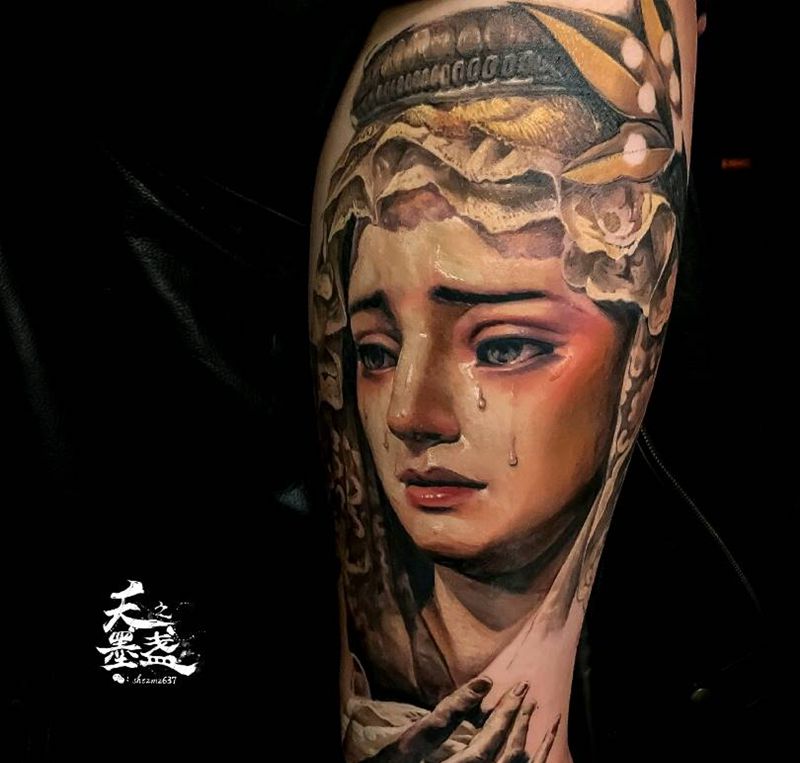 花腿进度纹身图片_腿部欧美写实圣母纹身图案