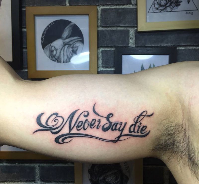 Never say die纹身图片