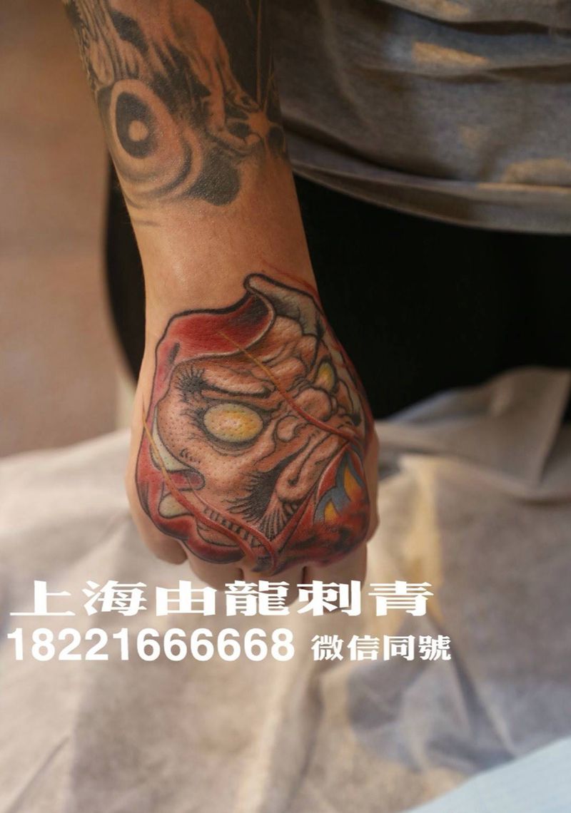 达摩纹身图片_手部传统人物纹身图案