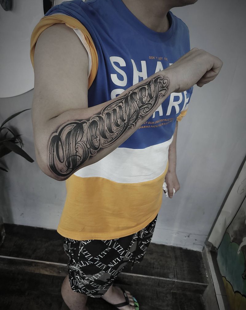 花体纹身图片_手臂花体字纹身图案