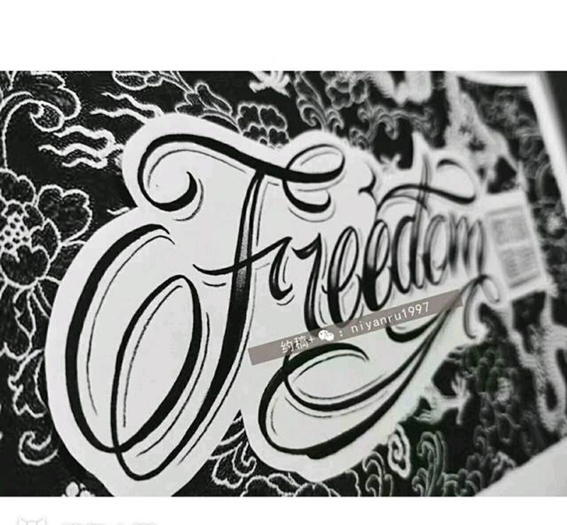 手臂奇卡诺花体纹身图片