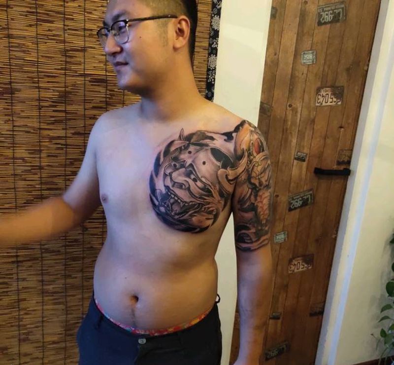 半甲纹身图片_胸部手臂老传统般若·象神纹身图案