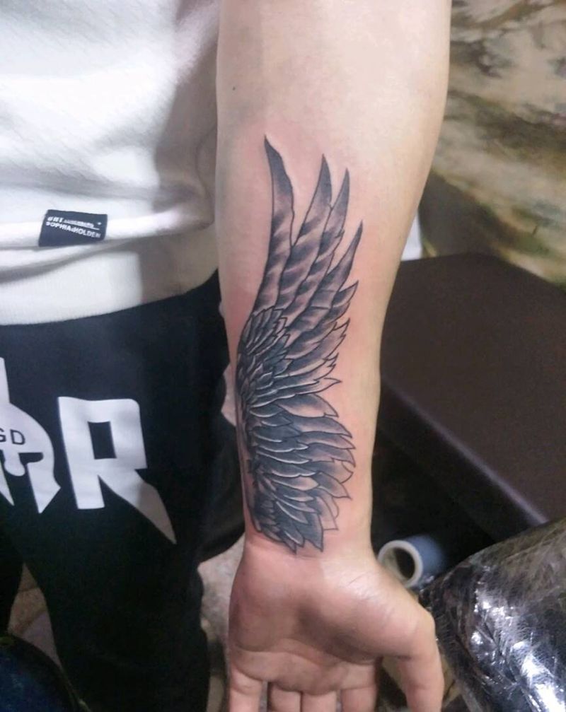 羽毛遮盖纹身图片_手臂新传统纹身图案