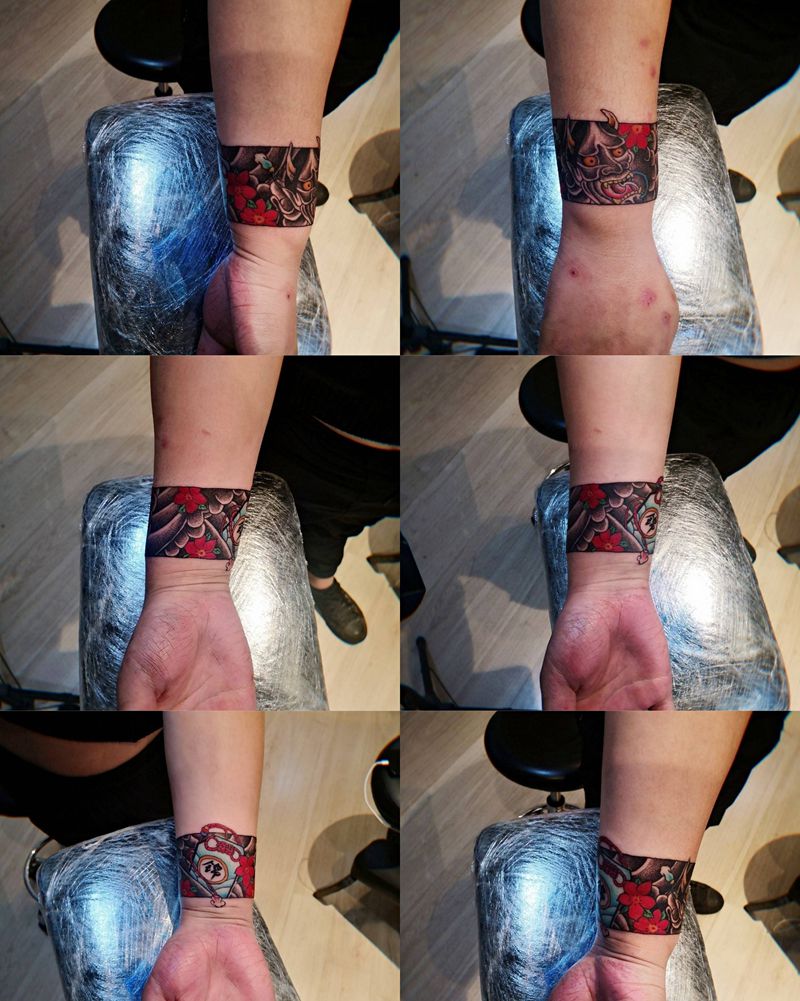 般若臂环纹身图片_手臂点刺水彩般若臂环纹身图案