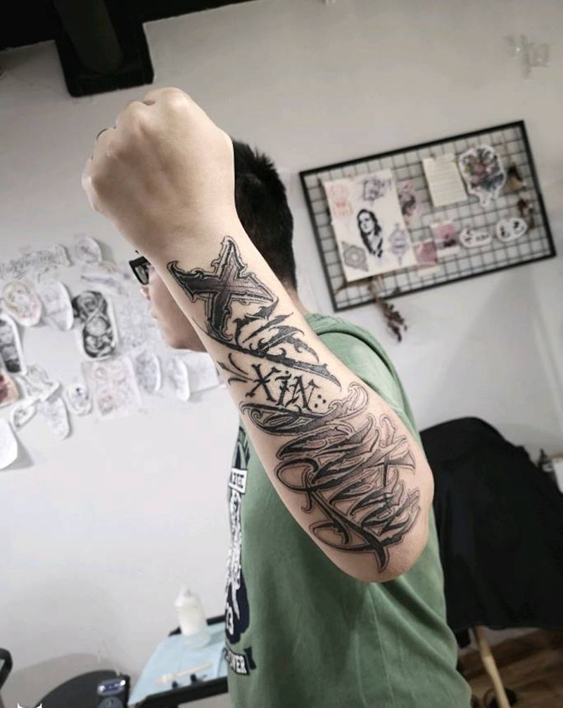 花体字纹身图片_手臂花体字纹身图案