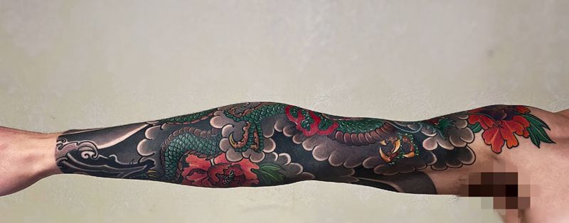 花臂龙纹身图片_手臂老传统纹身图案