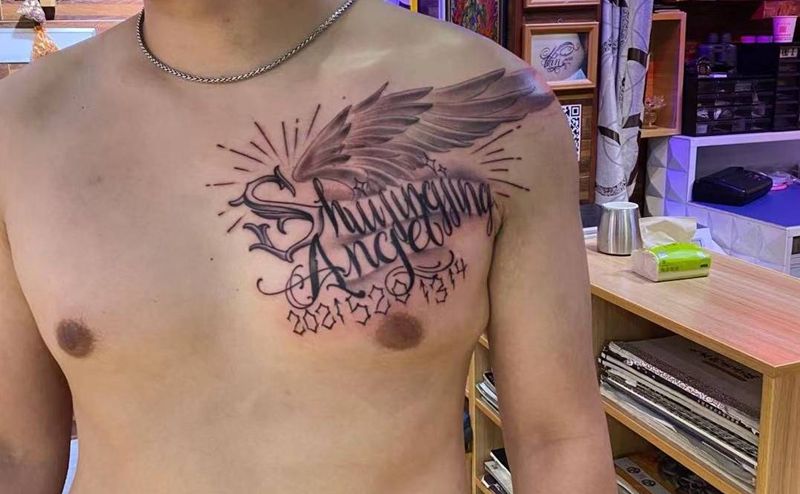 翅膀纹身图片_胸部纹身图案