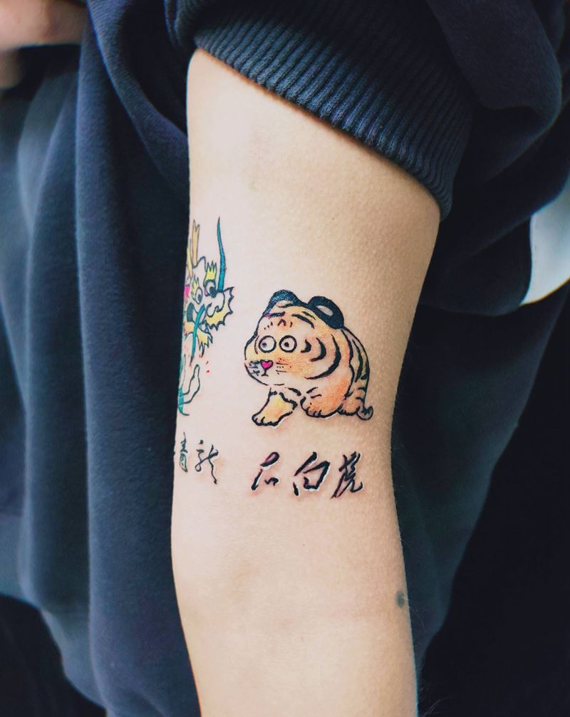 龙虎斗纹身图片_手臂水彩龙虎纹身图案