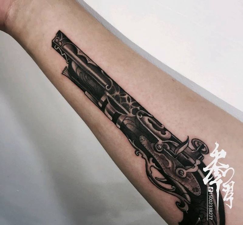 黑灰火铳纹身图片