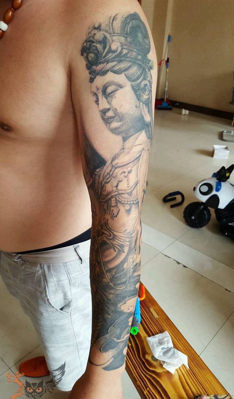 游龙护佛纹身图片_手臂欧美传统肖像人物鬼神原创石雕纹身图案