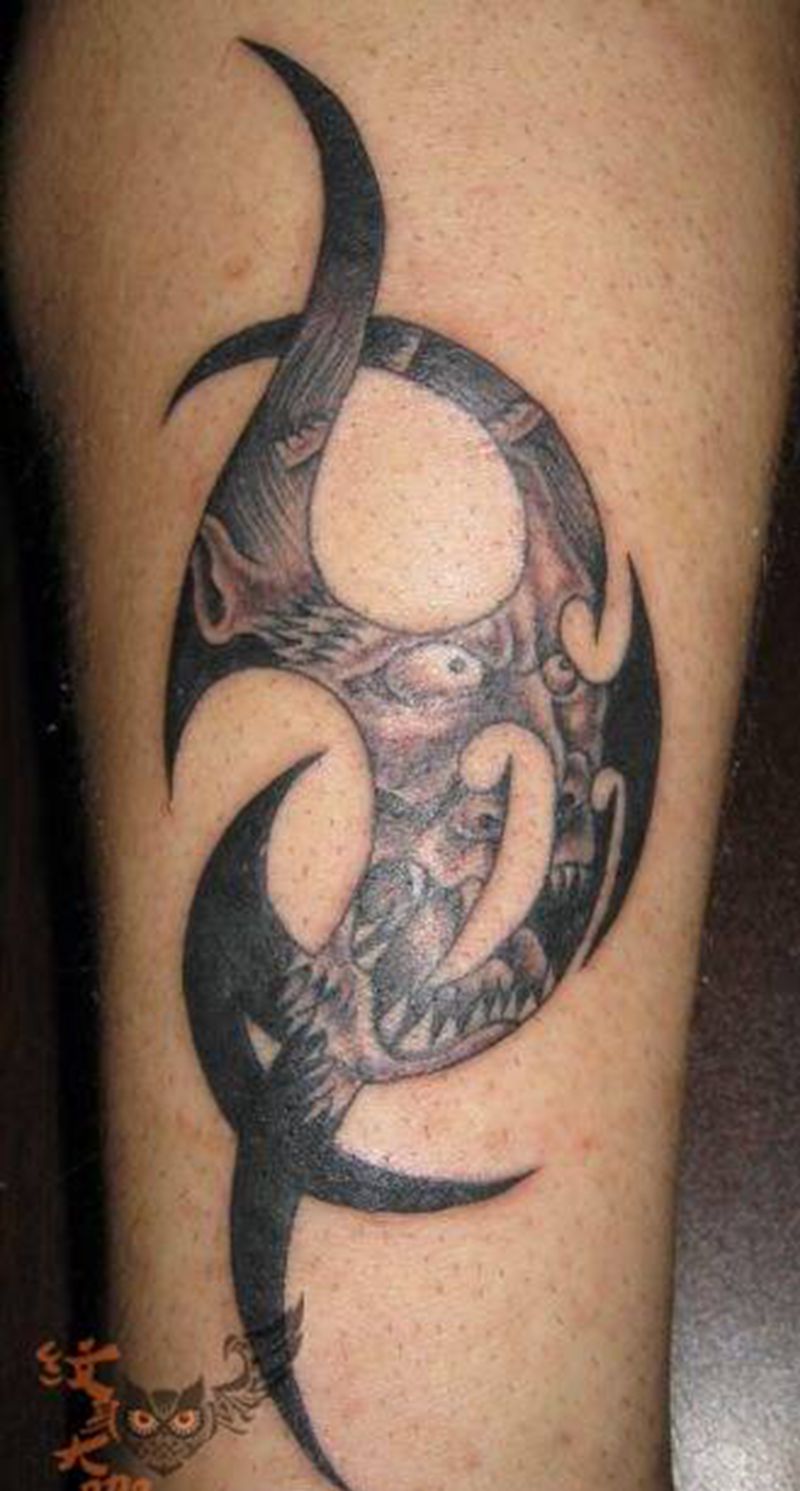 图腾脸谱纹身图片_腿部鬼神传统成品纹身图案