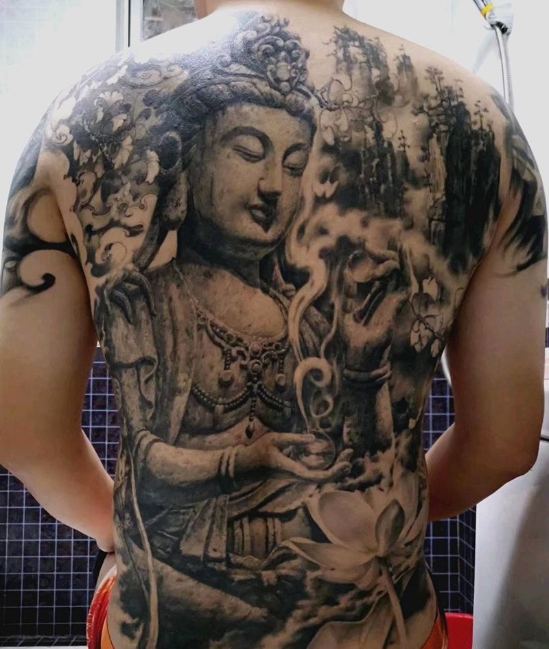 佛纹身图片_石雕纹身图案