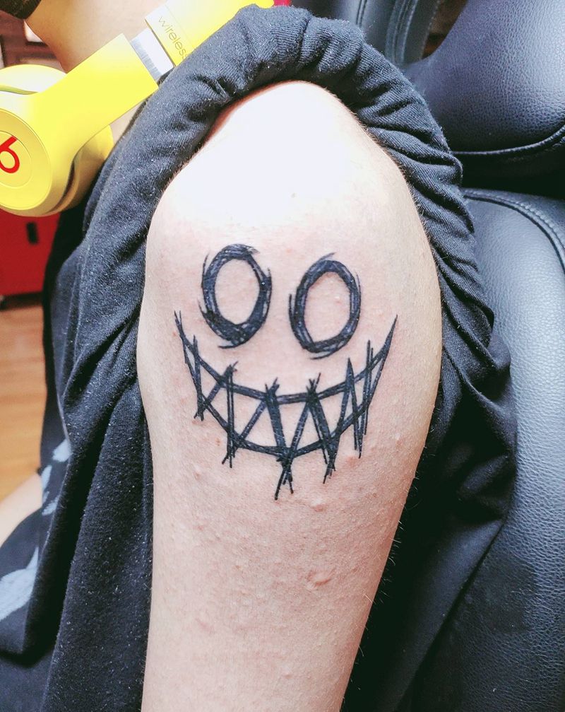 笑脸纹身图片_手臂纹身图案