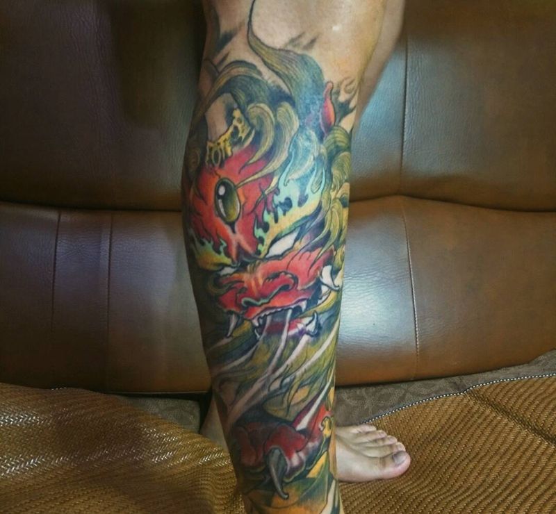 唐狮荷花纹身图片