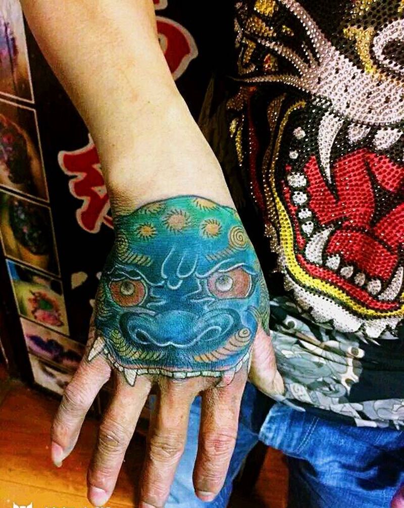 唐狮遮盖纹身图片