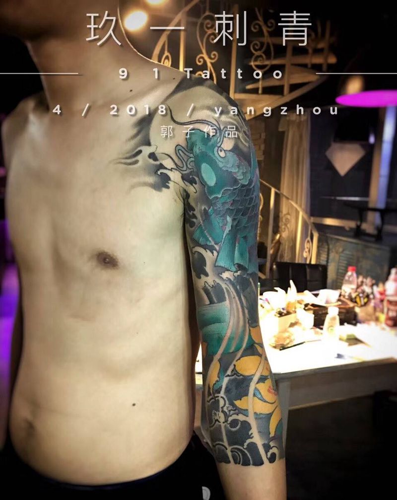 七分袖鱼纹身图片_传统动物手臂成品纹身图案