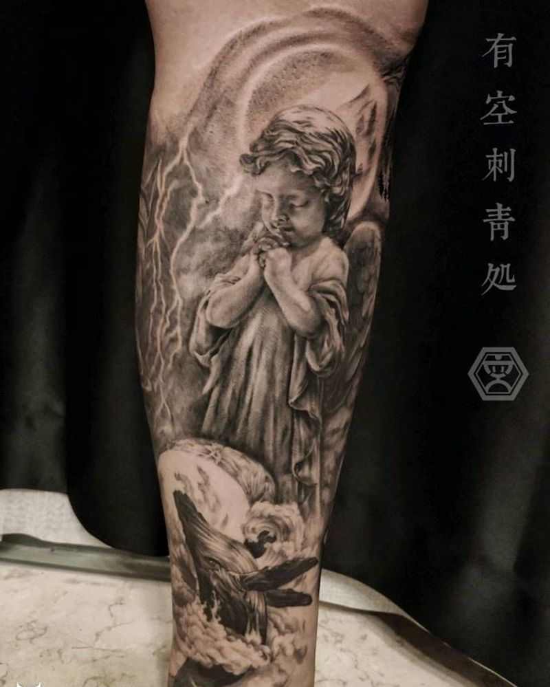祈祷天使纹身图片_腿部欧美写实纹身图案