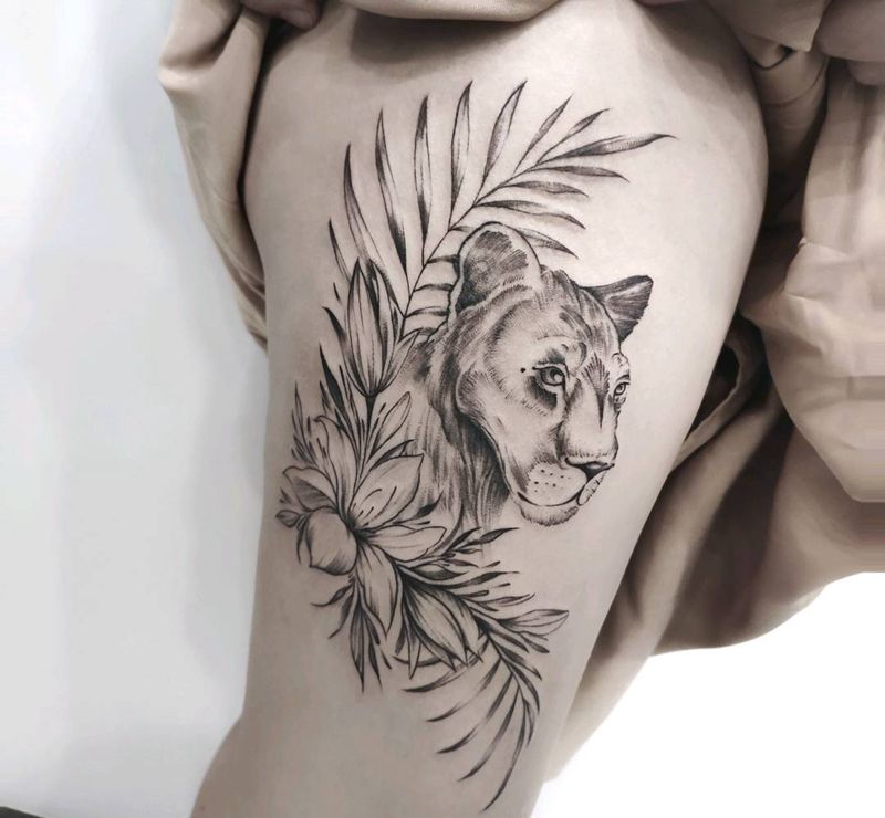 母狮纹身图片_腿部点刺欧美写实纹身图案