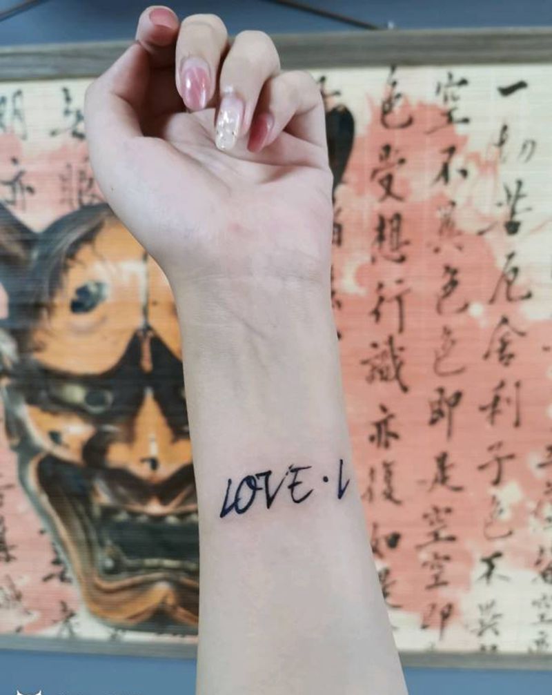 字母纹身图片_手臂花体字纹身图案