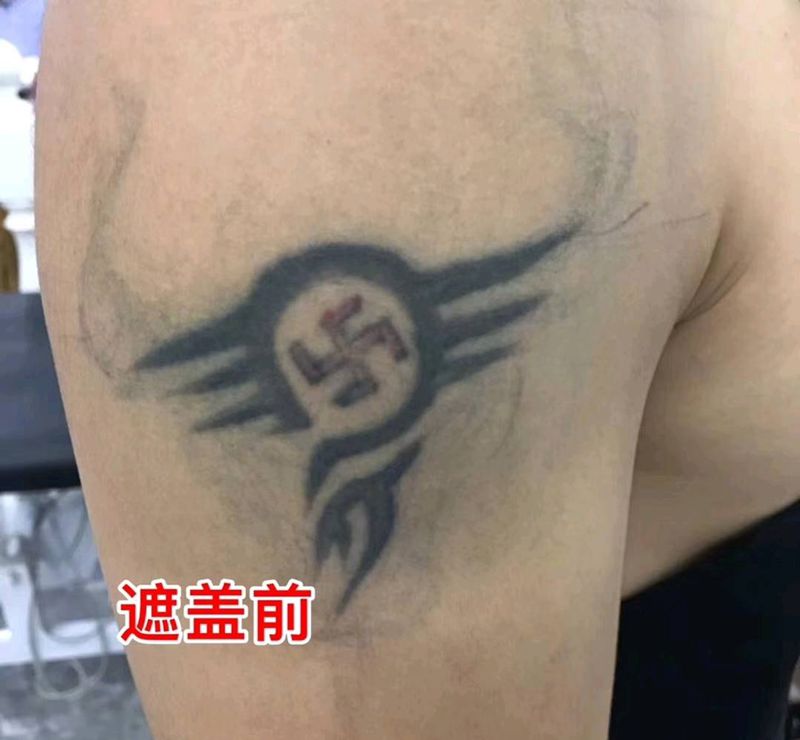 图腾遮盖牛牛纹身图片_手臂图腾纹身图案