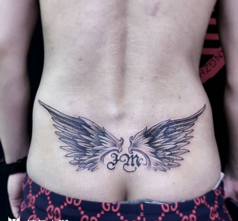 翅膀纹身纹身图片_腰部纹身图案