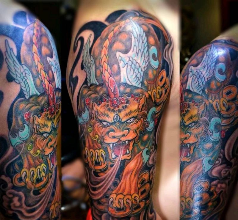 麒麟纹身纹身图片_手臂老传统纹身图案