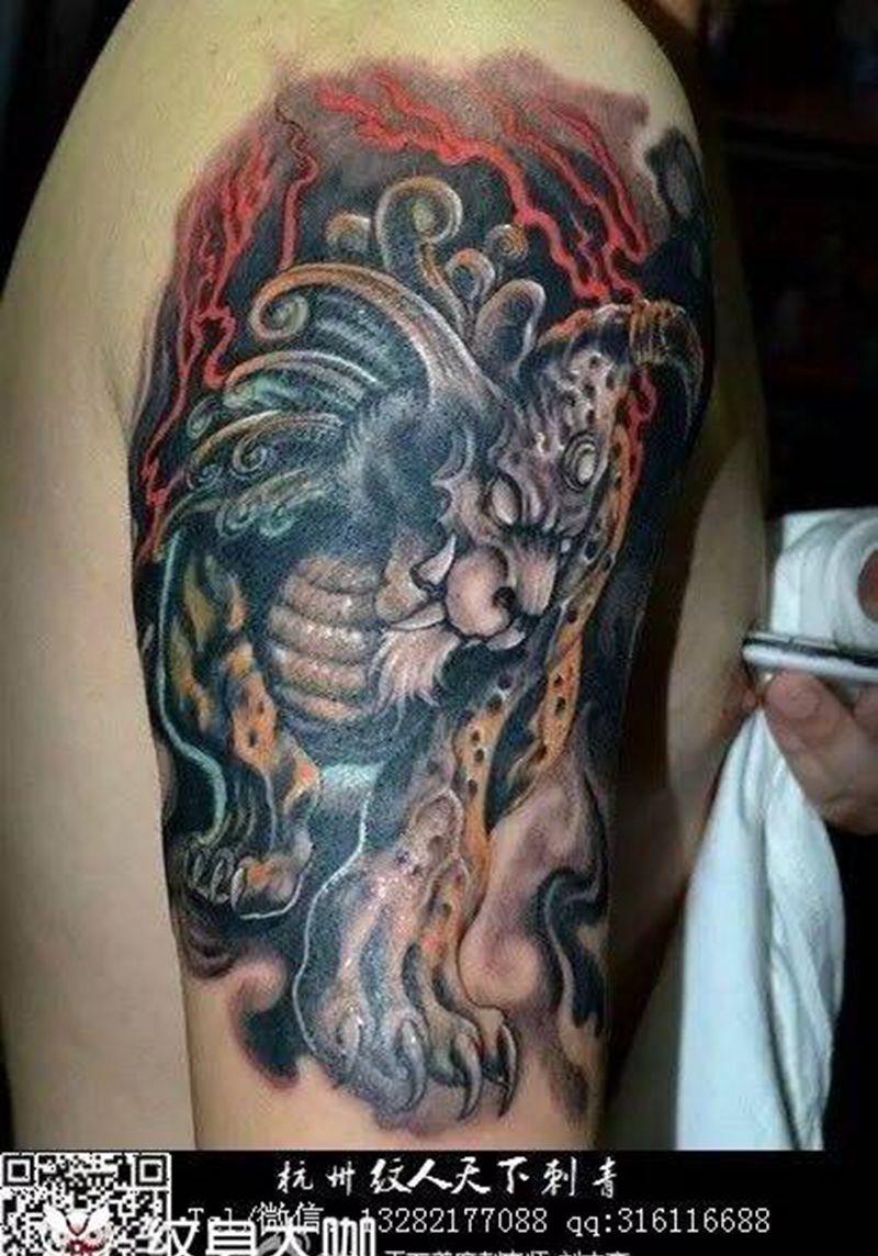 谛听遮盖十字架纹身图片