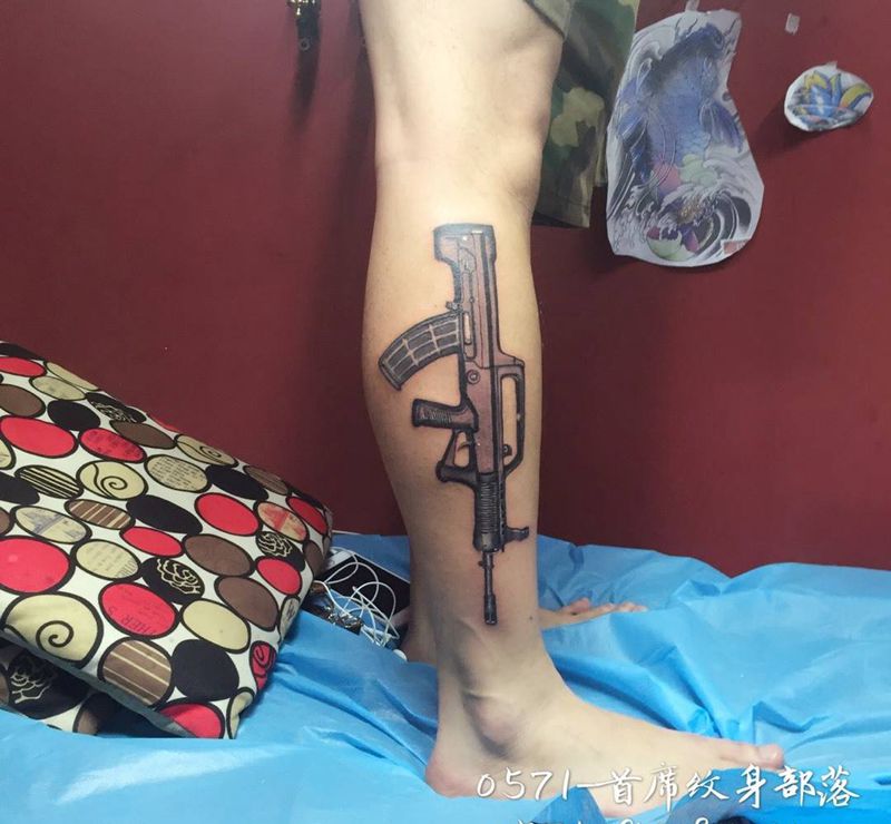小腿步枪。纹身图片