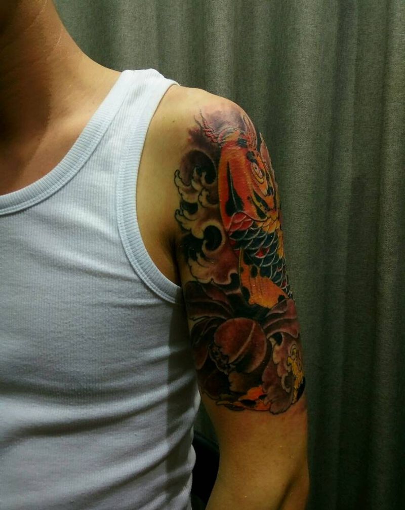 大臂鲤鱼纹身图片_手臂传统动物成品纹身图案