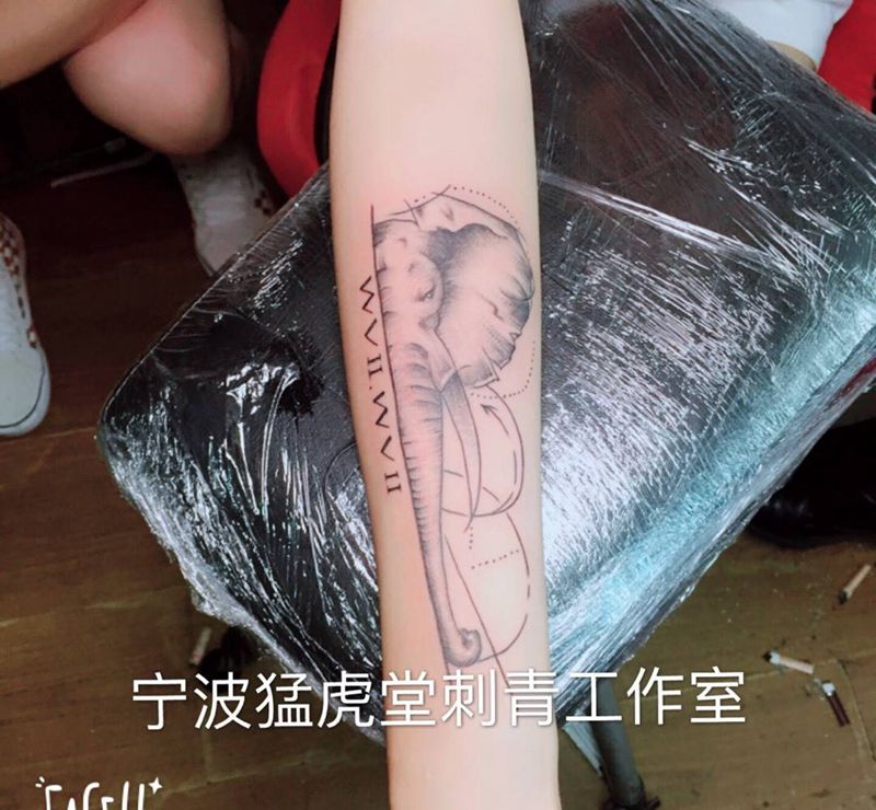 象纹身图片_成品手臂传统鬼神动物几何纹身图案