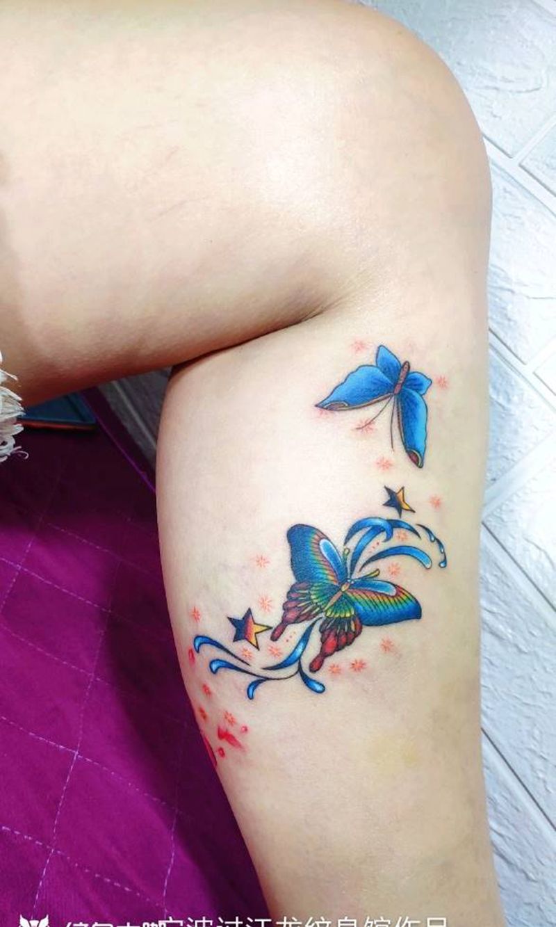 花蝶遮盖疤痕和静脉曲张纹身图片_腿部脚部新传统水彩花蝶纹身图案