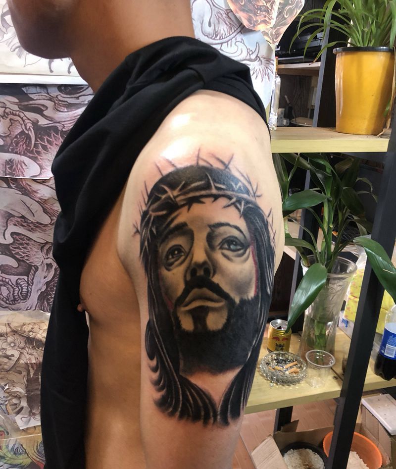 耶稣遮盖纹身图片_手臂欧美写实纹身图案