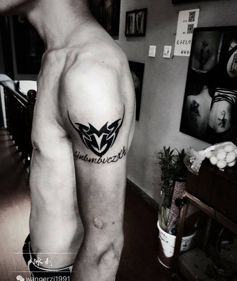 图腾黑纹身图片_手臂传统图腾纹身图案