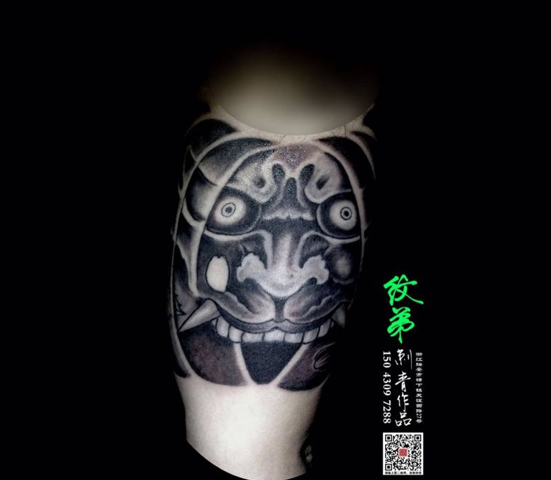 象神添加包大臂纹身图片_成品手臂传统欧美人物鬼神纹身图案