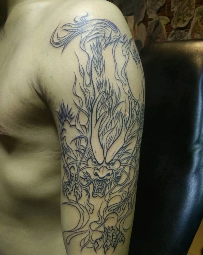 手臂麒麟勾线纹身图片