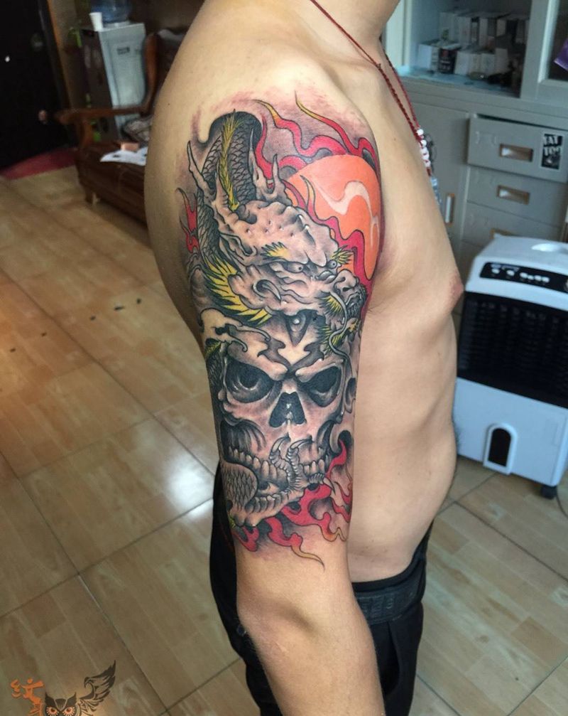 大臂龙骷髅头纹身图片