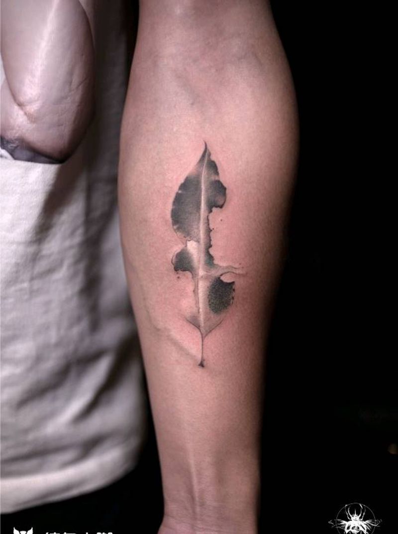 绿叶重生纹身图片_手臂水墨纹身图案