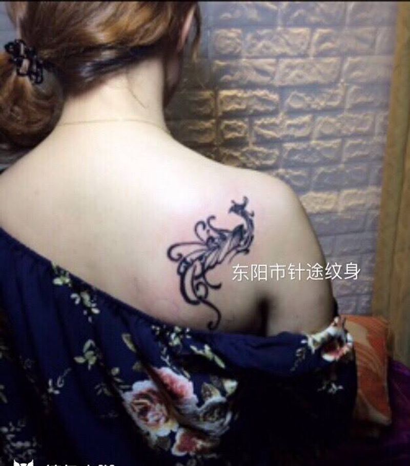 图腾凤凰与小丑纹身图片