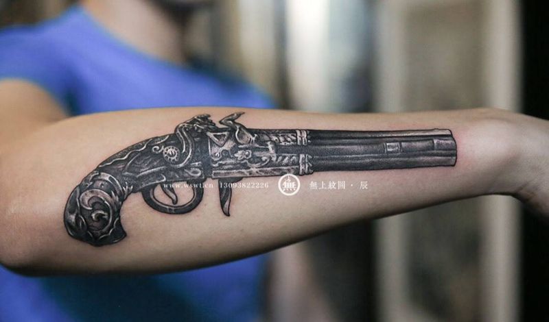 手臂枪纹身图片_成品手臂欧美清新静物无上纹图图腾纹身图案