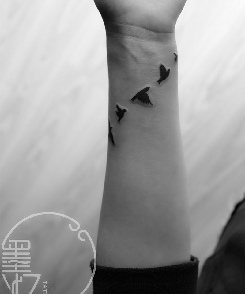 手臂飞鸟纹身图片