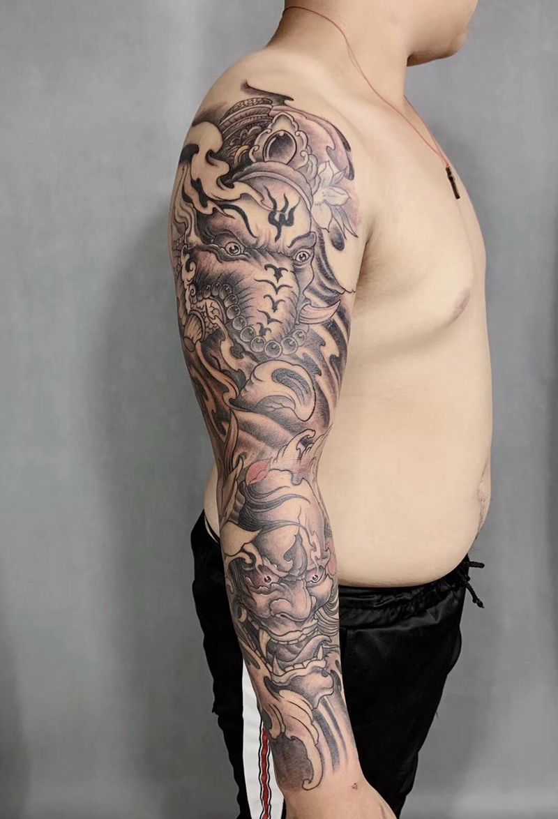 传统花臂纹身图片_手臂新传统象神般若纹身图案